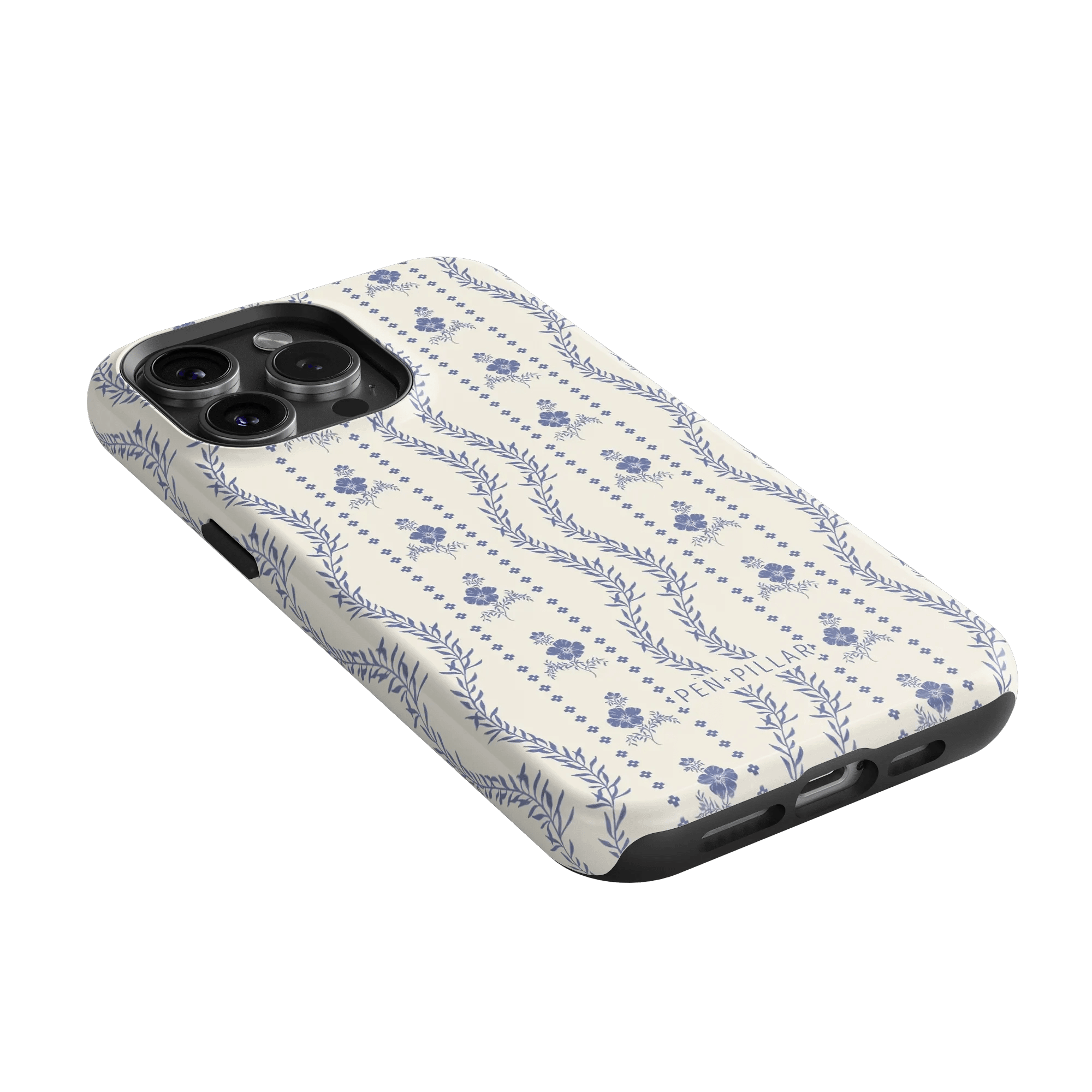 Riviera iPhone case featuring a floral pattern in blue on a cream background, angled to show the camera cutout.