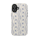 Riviera iPhone case featuring a floral pattern in blue on a cream background with a black edge.