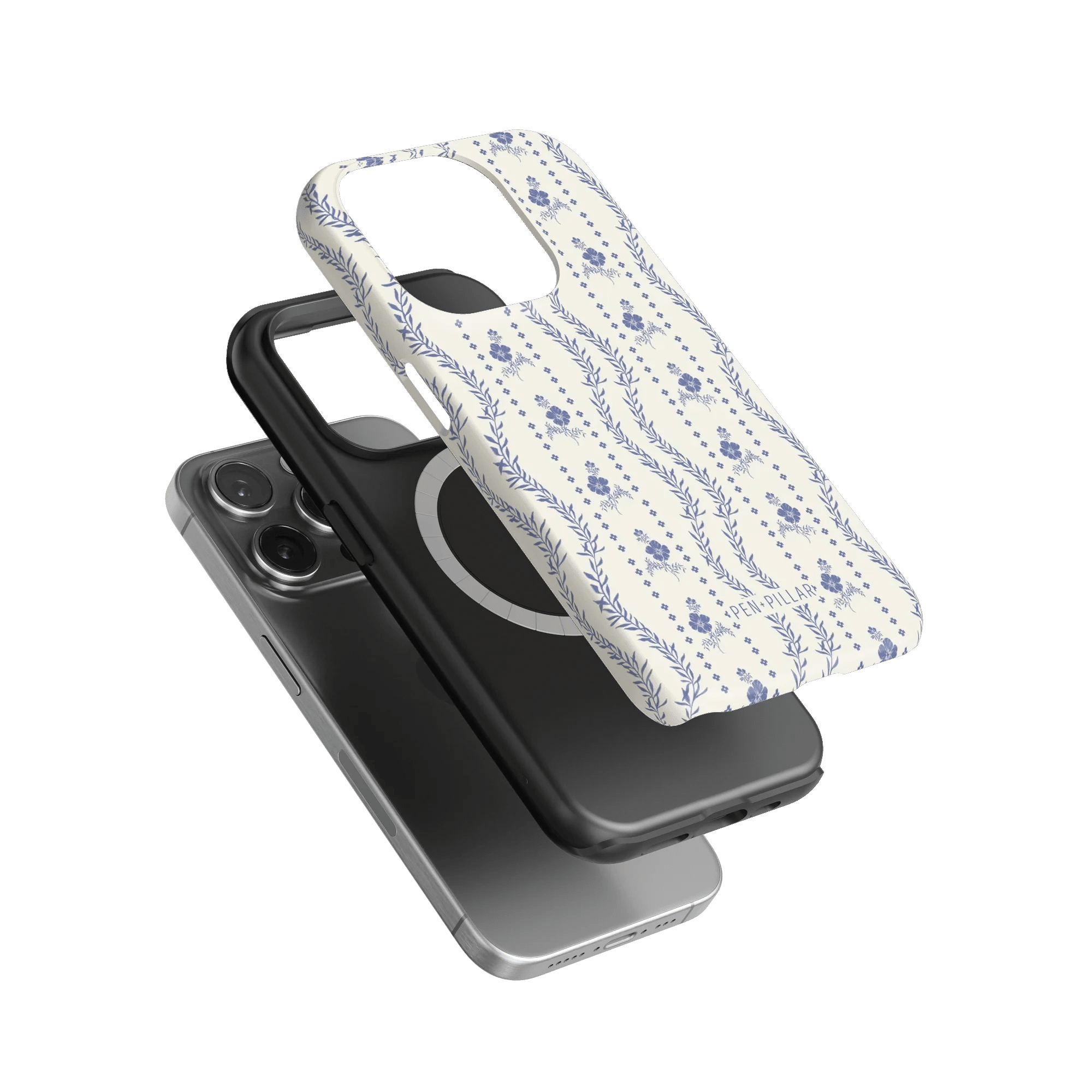 Riviera iPhone case featuring a floral design in blue on a white background, layered over two black phone cases.