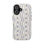 Riviera iPhone case featuring a floral pattern in blue on a cream background with black edges.