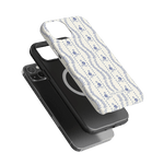 Riviera iPhone case featuring a floral pattern on a white background, shown with a black phone case underneath.