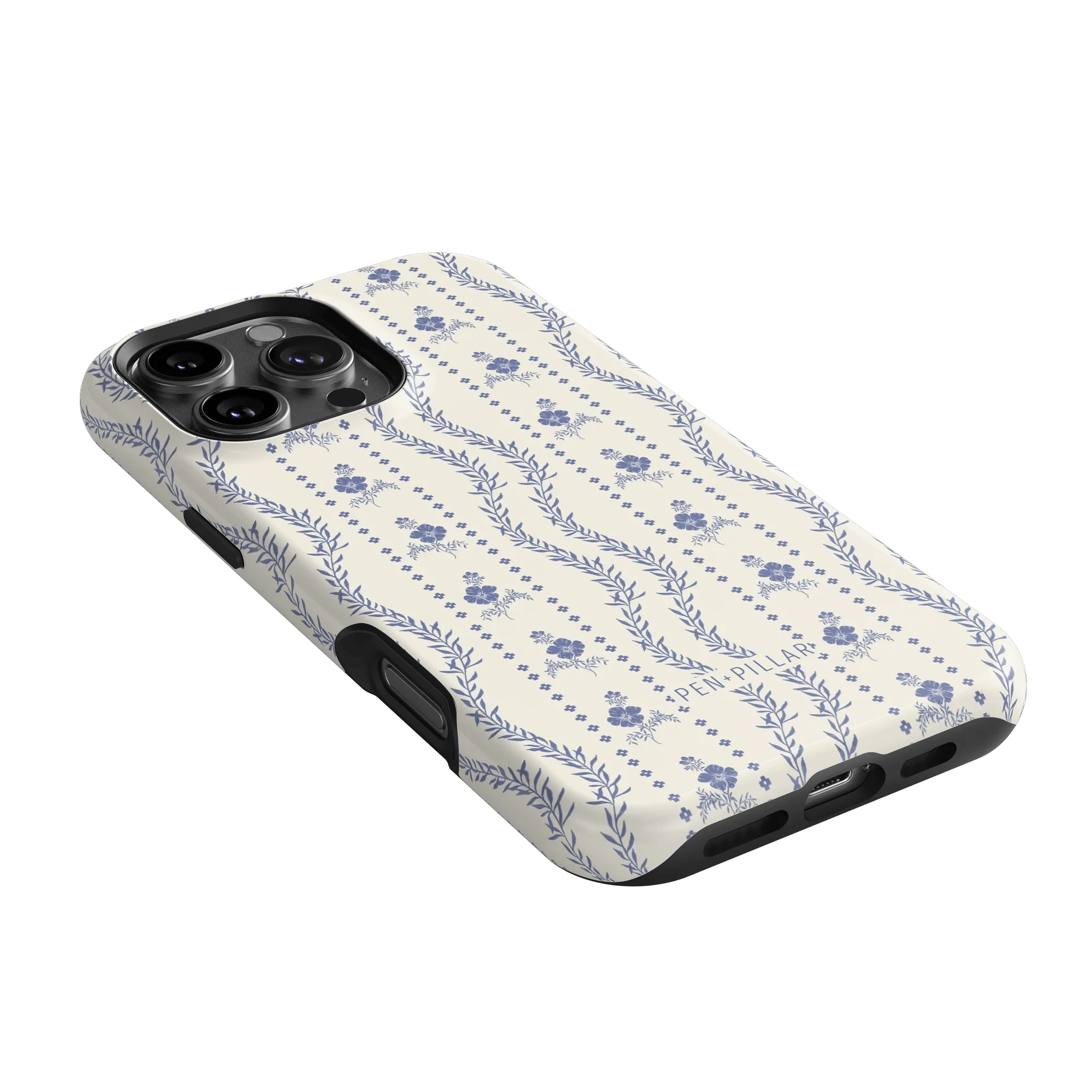 Riviera iPhone case featuring a floral pattern in blue on a cream background, angled to show the camera cutout.
