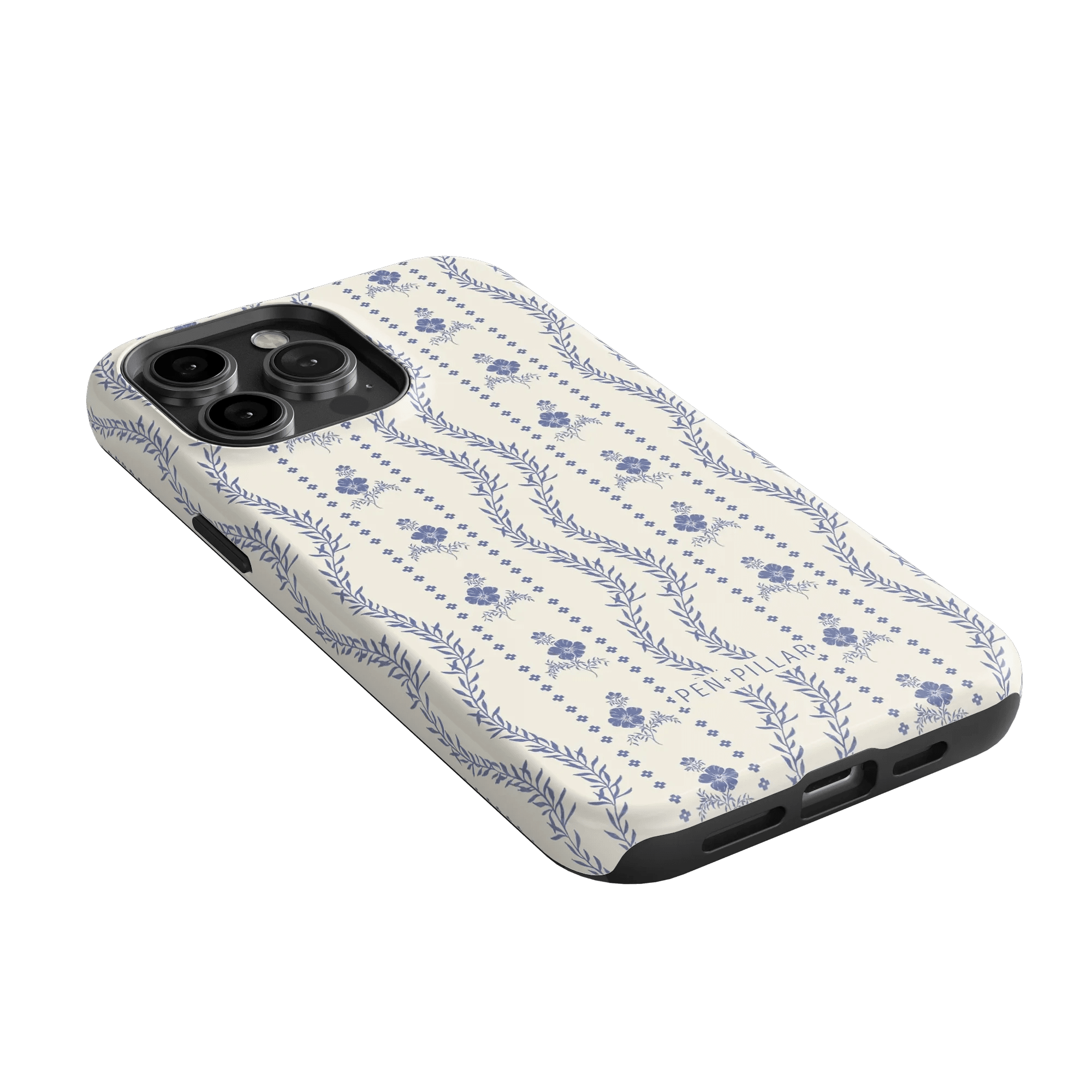 Riviera iPhone case featuring a floral pattern in blue on a cream background, angled to show the camera cutout.