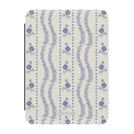 Riviera Kindle case featuring a floral pattern in blue and white with wavy lines and a textured finish.