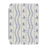 Riviera Kindle case featuring a floral pattern in blue and white with wavy lines and a textured finish.