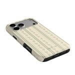 Roselle iPhone case featuring a floral pattern on a cream background, angled to show the camera cutout and buttons.