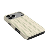 Roselle iPhone case featuring a floral pattern on a cream background, angled to show the camera cutout and buttons.