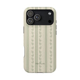 Roselle iPhone case featuring a floral striped design in soft green and cream colors with a black camera cutout.