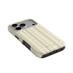 Roselle iPhone case featuring a floral pattern in soft green and cream colors, angled to show the camera cutout.