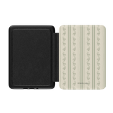 Roselle Kindle case with a black exterior and a floral patterned interior featuring green stripes and small flowers.