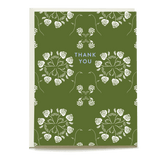 Roses thank you card featuring white roses on a green background with "Thank You" text in blue.
