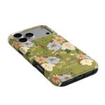 Scarlett iPhone case featuring a floral design with pastel flowers on an olive green background.