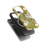 Scarlett iPhone case featuring a floral design with green background and black protective case underneath.