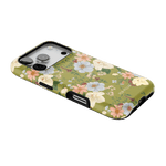 Scarlett iPhone case featuring a floral design with pastel flowers on a green background, angled to show the side.