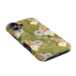 Scarlett iPhone case featuring a floral design with pastel flowers on a green background.