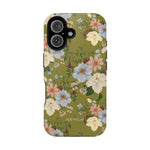 Scarlett iPhone case featuring a floral design with pink, blue, and white flowers on a green background.