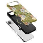 Scarlett iPhone case featuring a floral design on a green background with a black inner shell.