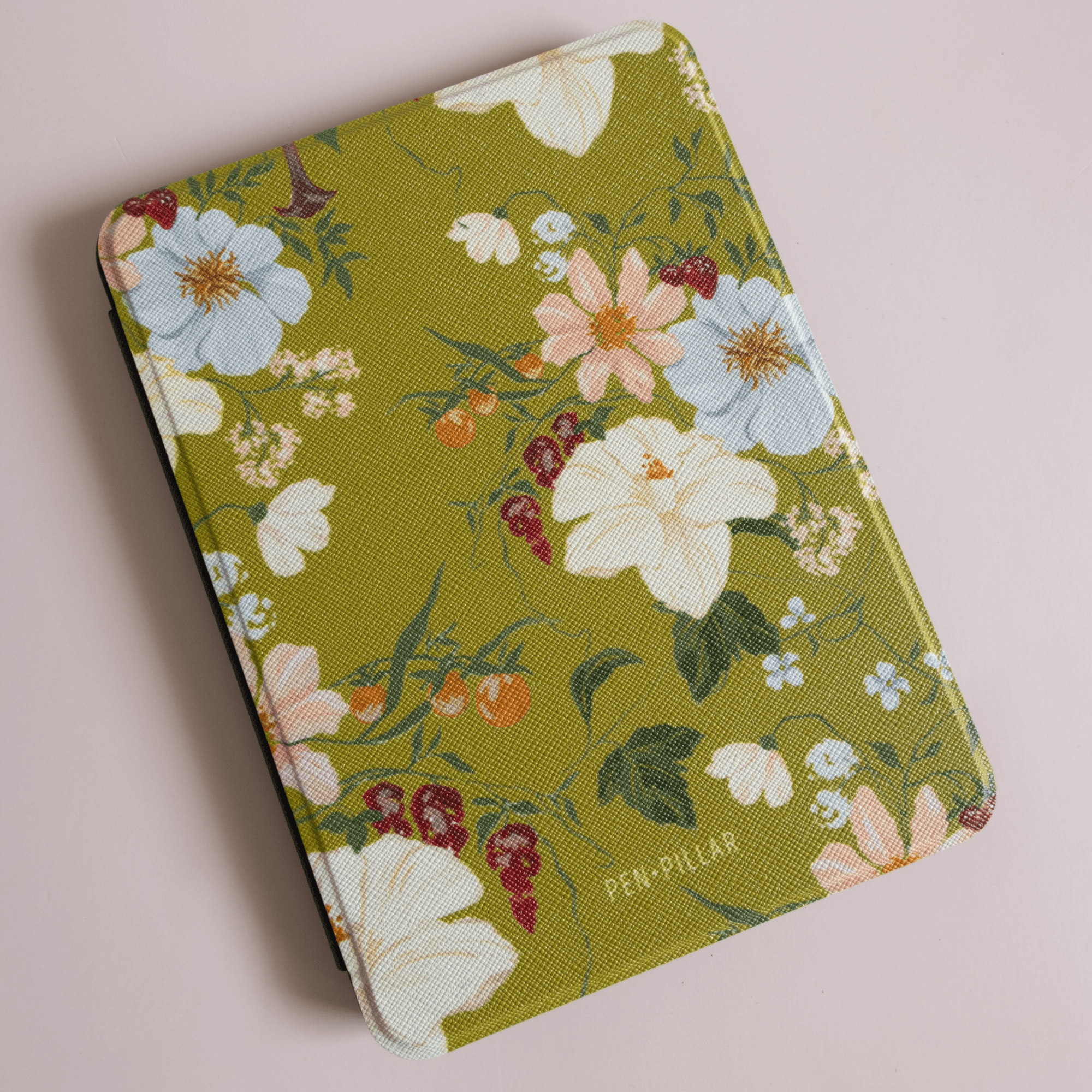 Scarlett Kindle case featuring a floral design on a green background with various colorful flowers.