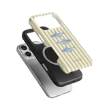 Sea Stripes iPhone case featuring a striped design with fish illustrations in blue and beige, stacked on two other cases.