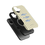 Sea Stripes iPhone case featuring a striped design with fish illustrations, layered over a black phone case.