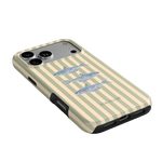 Sea Stripes iPhone case featuring a cream and beige striped design with three fish illustrations on the back.