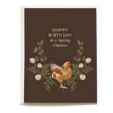 Happy birthday card featuring a chicken surrounded by flowers and a bee on a dark brown background.