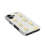 Springtide iPhone case with a floral design and blue stripes, angled view showing buttons and ports.