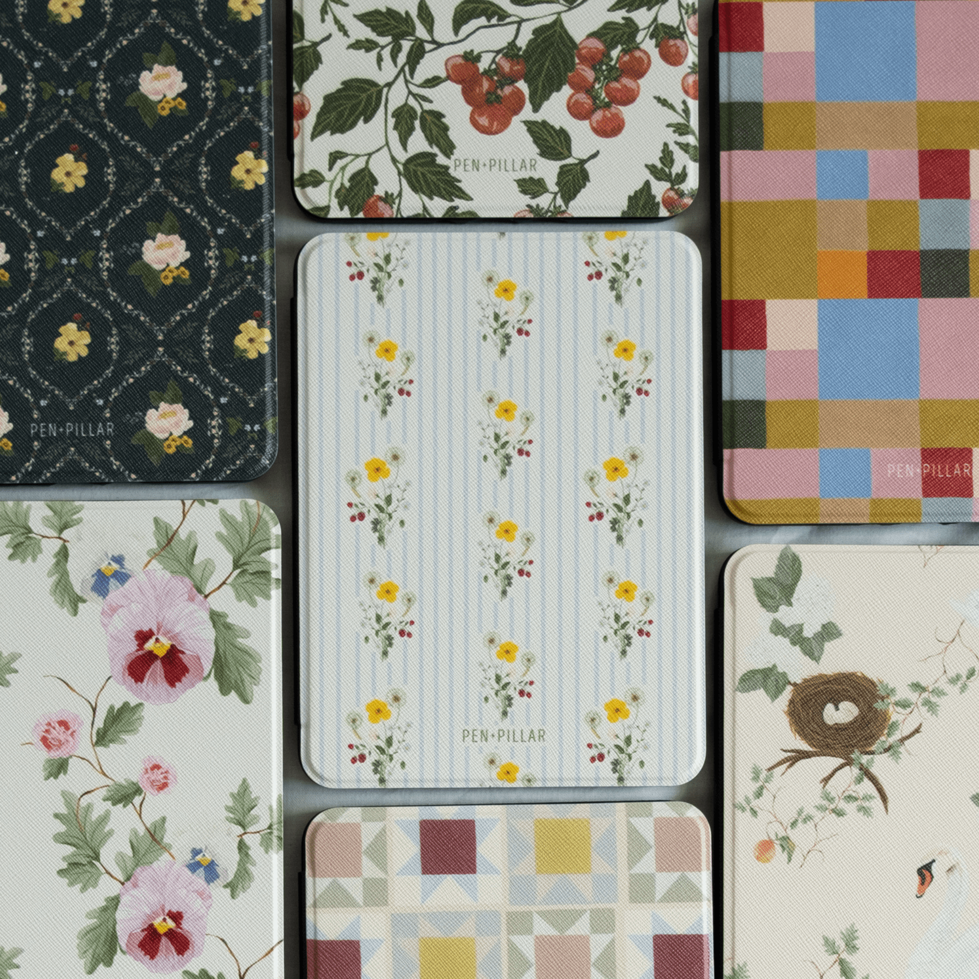 Springtide Kindle case featuring a floral design with yellow flowers on a striped background, surrounded by various patter...