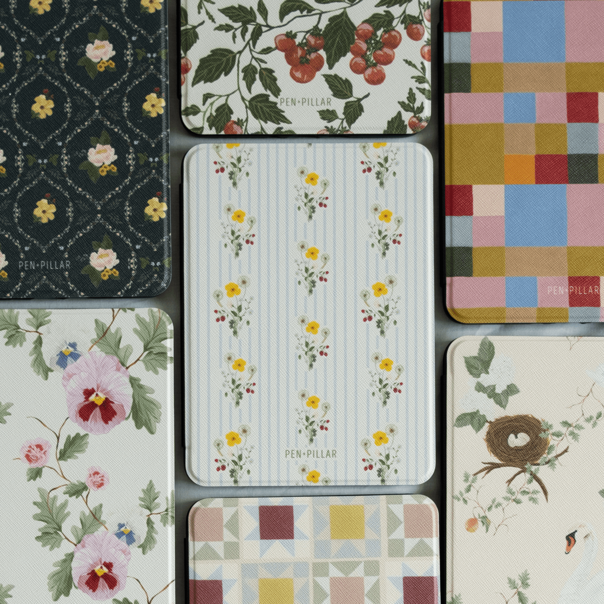 Springtide Kindle case featuring a floral design with yellow flowers on a striped background, surrounded by various patter...