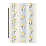 Springtide Kindle case featuring a floral design with yellow and white flowers on a striped blue background.