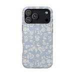 Spritz iPhone case featuring a light blue floral pattern with white flowers and leaves on a sleek design.