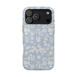Spritz iPhone case featuring a light blue floral pattern with white flowers and leaves on a sleek design.