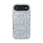 Spritz iPhone case featuring a light blue background with white floral patterns and a black camera cutout.