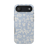Spritz iPhone case featuring a light blue background with white floral patterns and a black camera cutout.