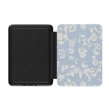 Spritz Kindle case featuring a light blue floral design with a black interior, shown open at an angle.