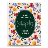Storybook Ending wedding card featuring floral design with the text "And they lived happily ever after" in a green oval.
