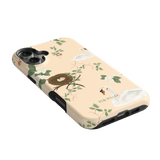 Swan Hollow iPhone case featuring swan illustrations, a nest, and green foliage on a light peach background.