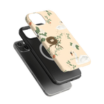 Swan Hollow iPhone case featuring a floral design with swans and a nest on a light background.