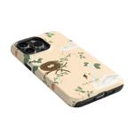 Swan Hollow iPhone case featuring a light beige background with swan and nest illustrations, surrounded by green foliage.