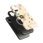 Swan Hollow iPhone case featuring a light background with swan and floral designs, layered over a black case.