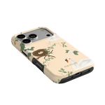 Swan Hollow iPhone case featuring swan and nest design with green foliage on a light background.