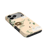 Swan Hollow iPhone case featuring swan and nest design with green foliage on a light background.