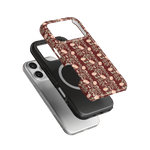 Thicket iPhone case featuring a floral design in burgundy, stacked over a black and a clear case.