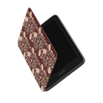 Thicket Kindle case with a floral pattern in shades of burgundy and cream, partially open to show the screen.