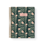 Thicket Notebook with a floral design featuring pink flowers on a dark green background and a gold spiral binding.