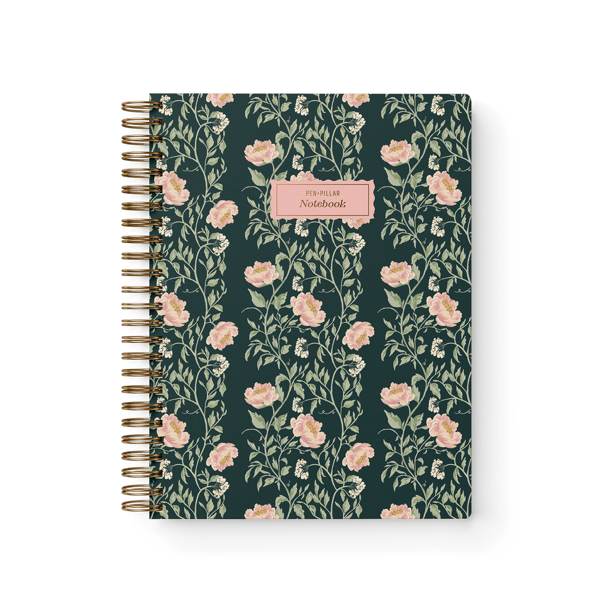 Thicket Notebook with a floral design featuring pink flowers on a dark green background and a gold spiral binding.