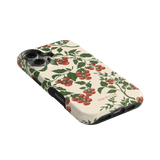 Tomato vines iPhone case featuring red cherry tomatoes on a cream background with black edges.