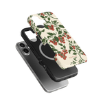 Tomato vines iPhone case featuring a floral design with red tomatoes on a cream background, shown from multiple angles.