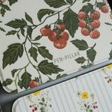 Tomato vines Kindle case featuring red cherry tomatoes and green leaves on a textured background.