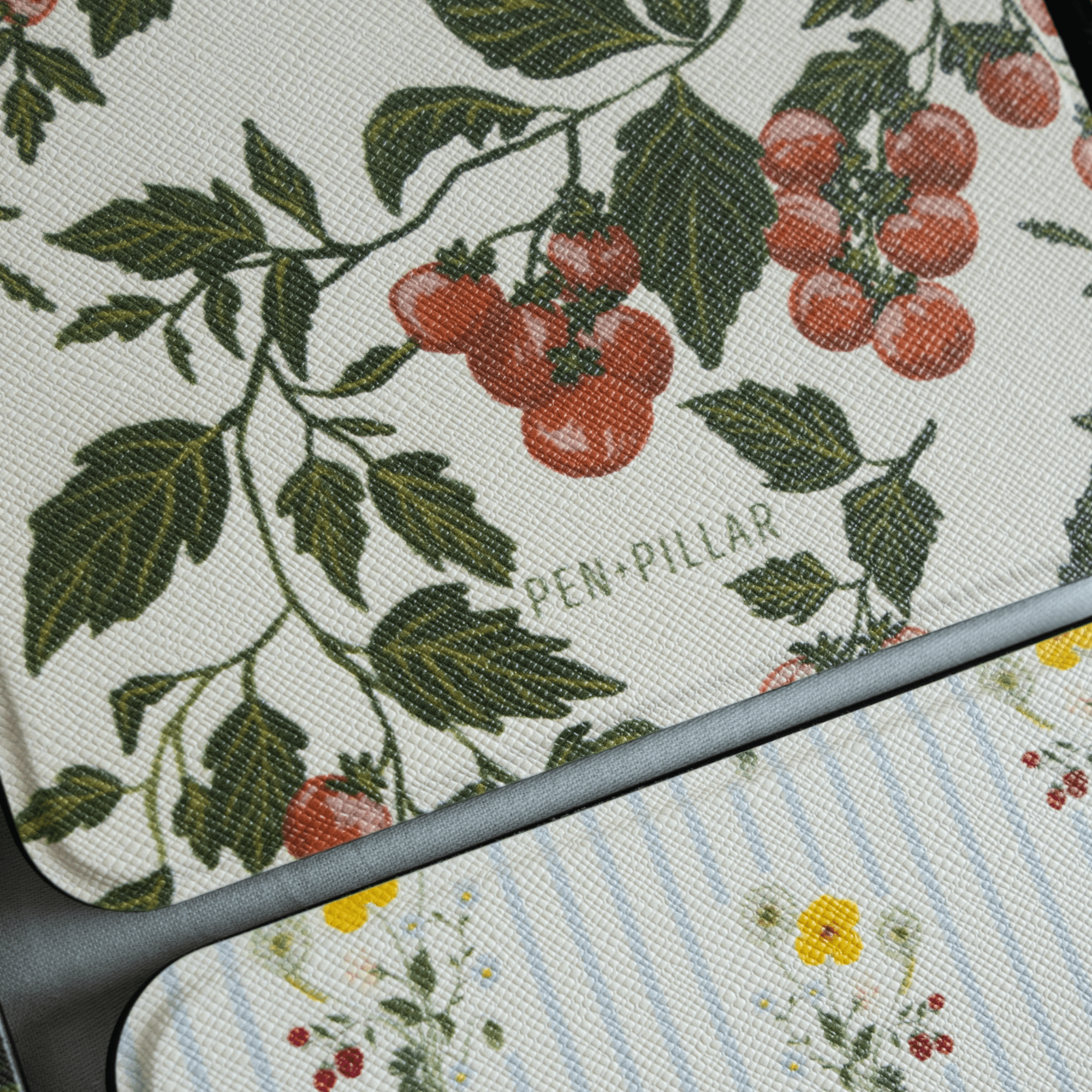 Tomato vines Kindle case featuring red cherry tomatoes and green leaves on a textured background.